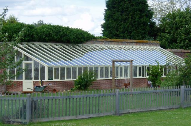 Greenhouse showing existing wall which was incorporated as part of the design