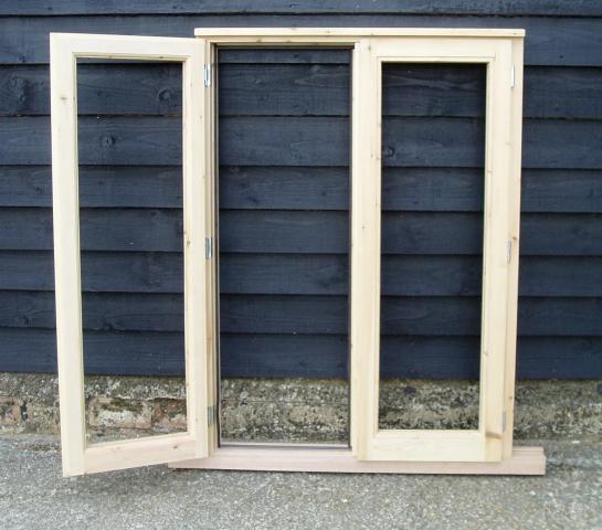 Storm proof window with fly mullion